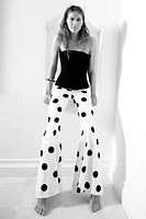 PANTALON FLARE À POIS TAILLE HAUTE
