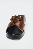 LEATHER CRISS CROSS BUCKLE SANDALS