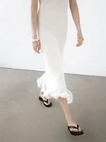 Knit dress with fringed hem