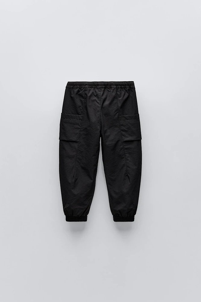 TECHNICAL FABRIC LINED PANTS WITH LABEL