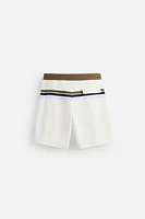 MAILLOT DE BAIN LONG À BANDES