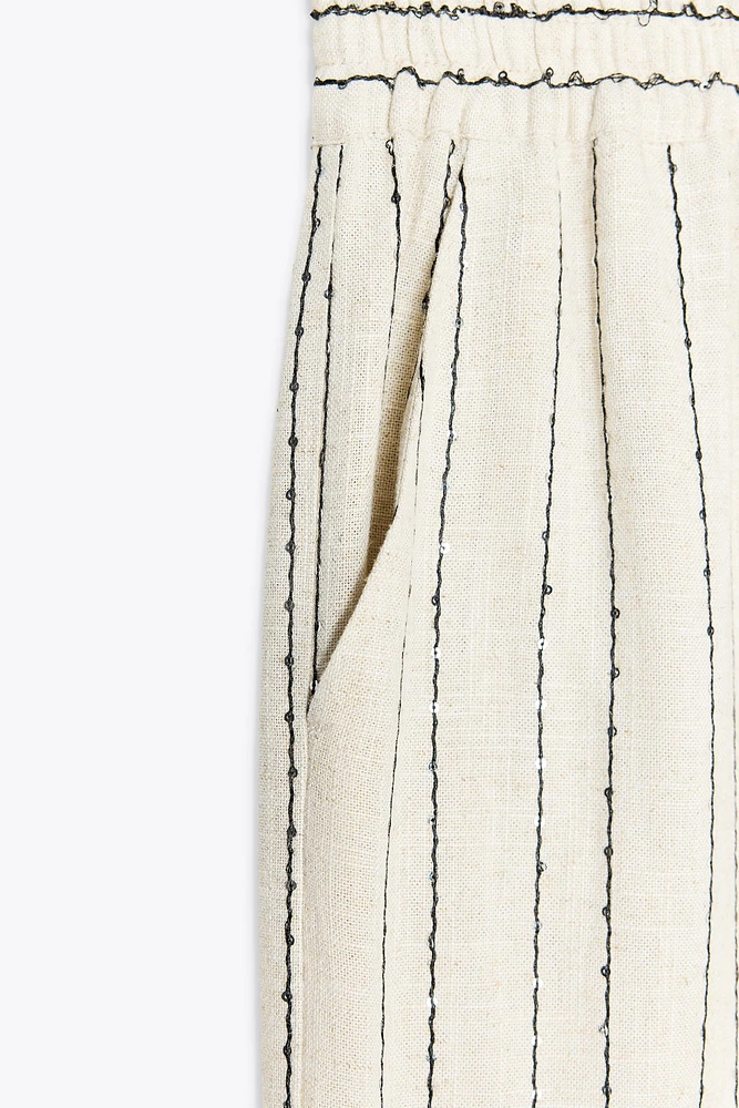 PANTALON RAYÉ À SEQUINS