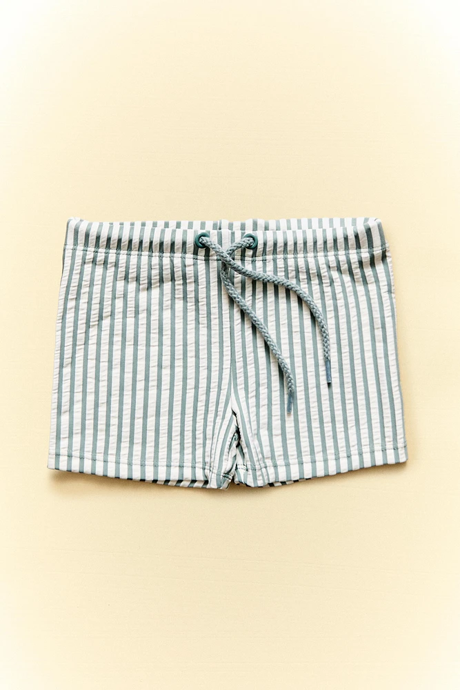 CHILDREN’S STRIPED BEACH SWIMMING TRUNKS