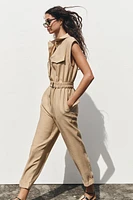 SLEEVELESS BELTED JUMPSUIT