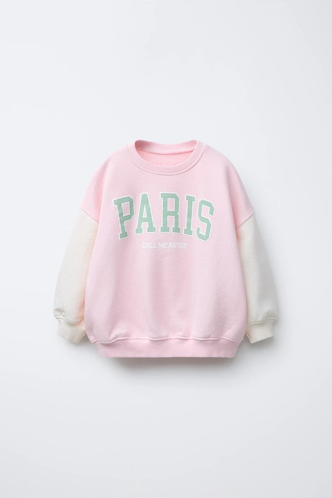 RAISED TEXT PRINT SWEATSHIRT