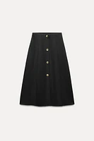 SOFT BUTTON MIDI SKIRT