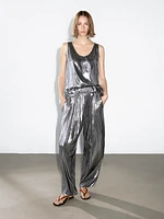 Flowing metallic trousers with gathered detail