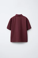 POLO BOXY FIT ÉTIQUETTE
