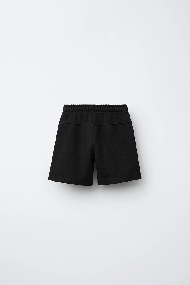 RAISED TEXT PLUSH SHORTS