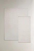 LIGHT-COLORED WOOL AREA RUG