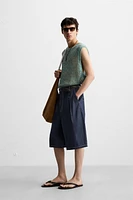 GILET SANS MANCHES EN MAILLE AJOURÉE