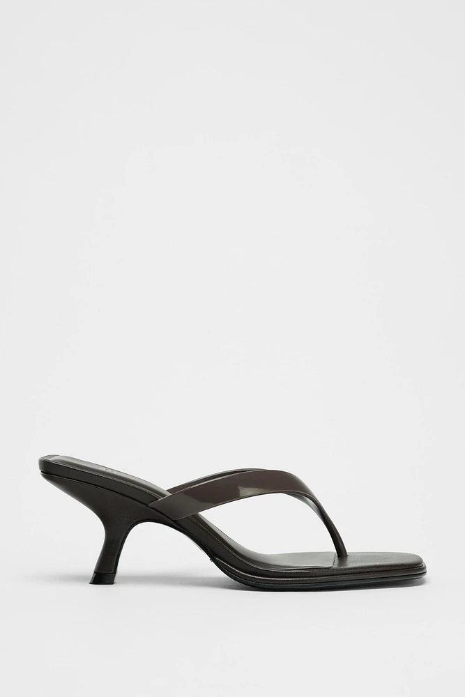 ASYMMETRIC HEELED SANDALS