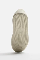 TENNIS VOLUME CUIR