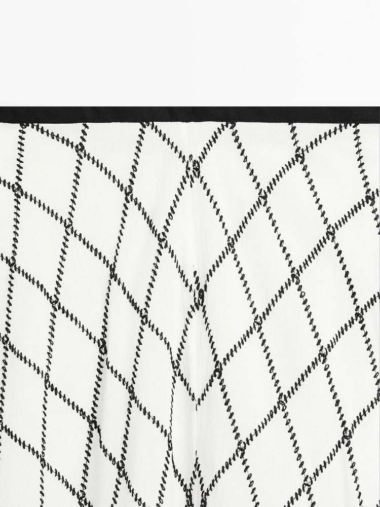 Jupe midi ample évasée à carreaux