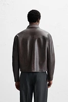 BLOUSON EN MATIÈRE SYNTHÉTIQUE DÉLAVÉE