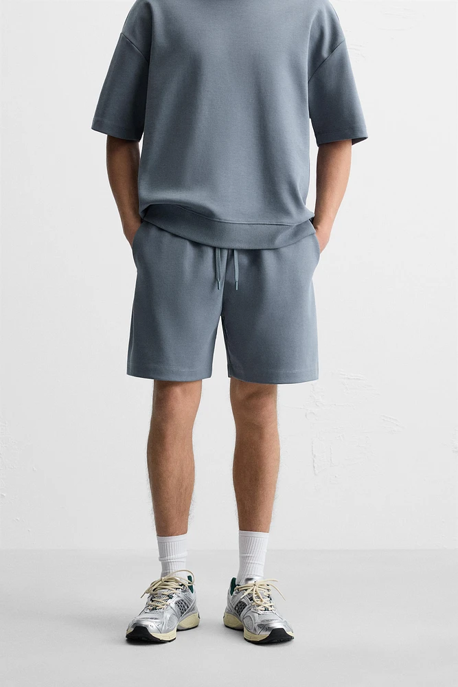 INTERLOCK STRUCTURED SHORTS