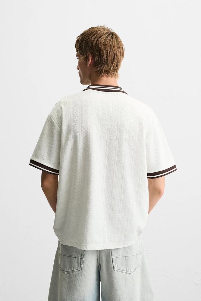 POLO JACQUARD INSCRIPTION BRODÉE