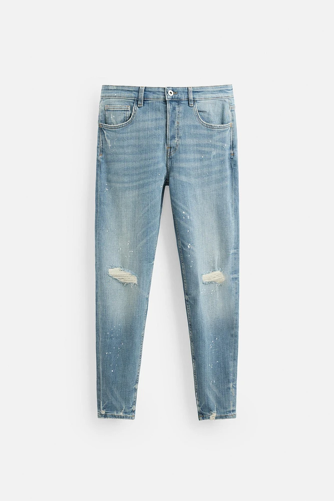 JEANS SKINNY AVEC DÉCHIRURES ET ÉCLABOUSSURES