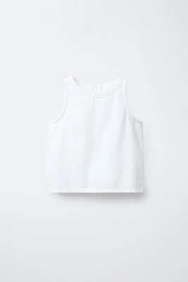 TOP SANS MANCHES ZIP