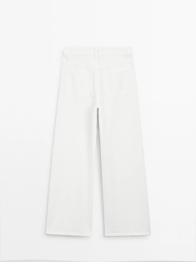 Jean wide leg taille haute avec découpes