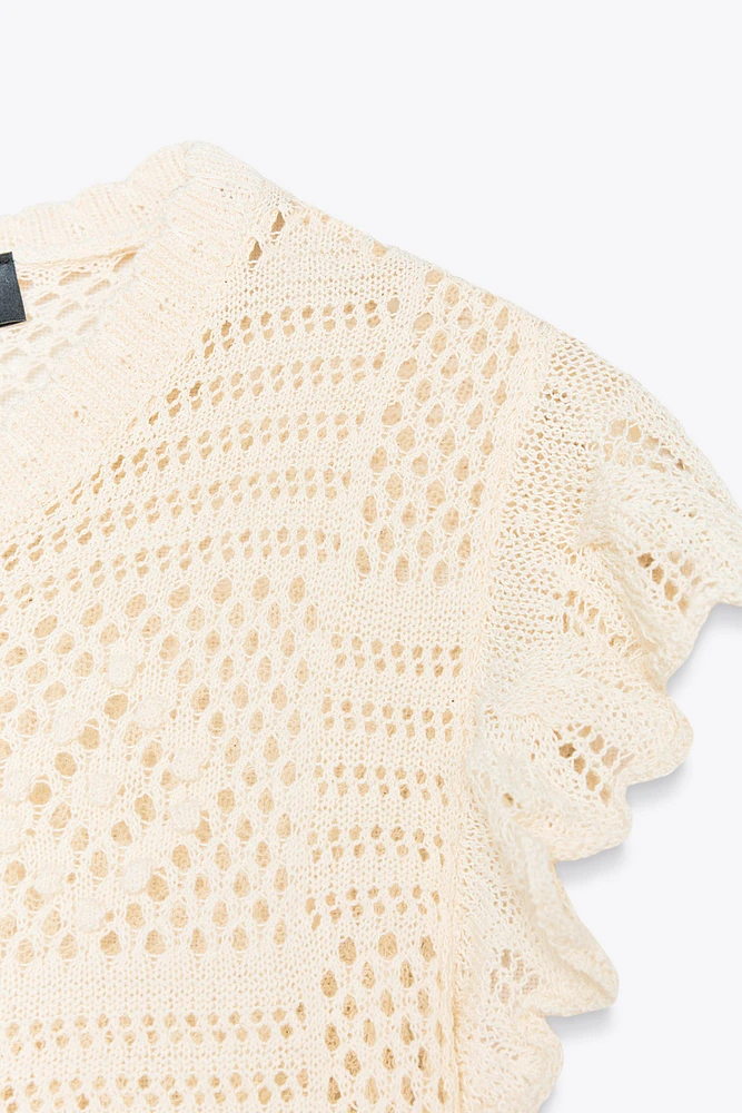 GILET EN MAILLE POINTELLE À VOLANTS