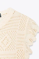 GILET EN MAILLE POINTELLE À VOLANTS