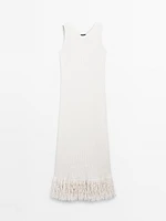 Knit dress with fringed hem