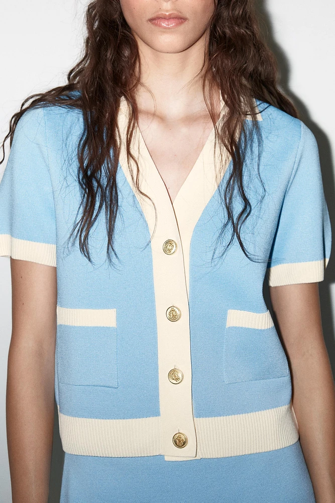 VESTE EN MAILLE MANCHES COURTES