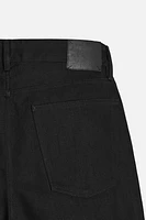 Slim fit jeans. Five pockets. Tonal topstitching. Front button closure.<br/><br/>Origins special collection.