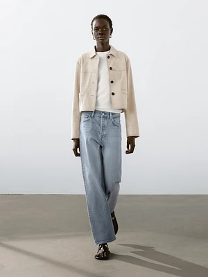 Veste courte à surpiqûres en cuir finition daim