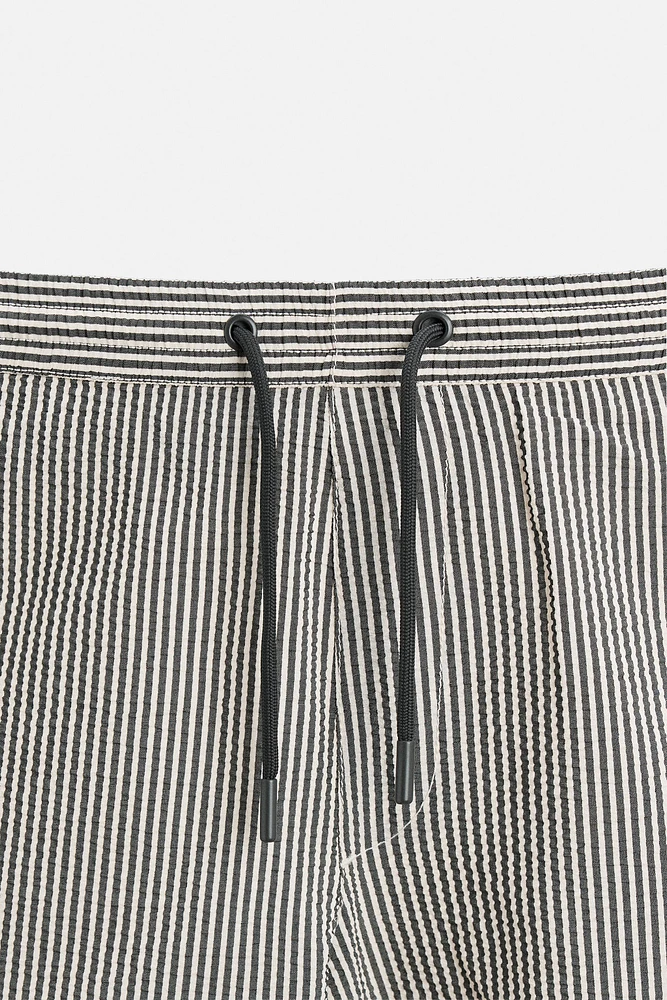 STRIPED SEERSUCKER REGULAR SWIM SHORTS