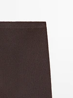 Long knit skirt with fringed hem