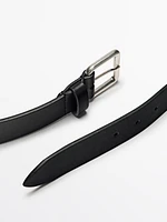 Leather belt with metallic buckle
