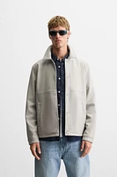 BLOUSON EN MATIÈRE SYNTHÉTIQUE