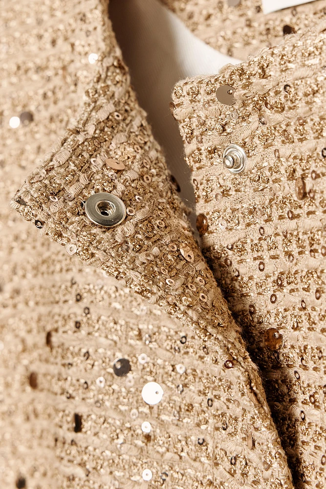 VESTE À SEQUINS ET CEINTURE