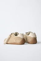 TENNIS EN CUIR À LACETS
