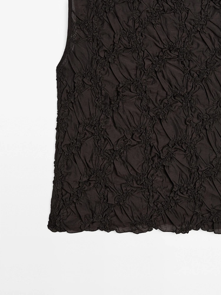 Creased-effect funnel neck top