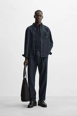 TEXTURED PLEATED PANTS
