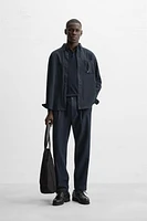 TEXTURED PLEATED PANTS