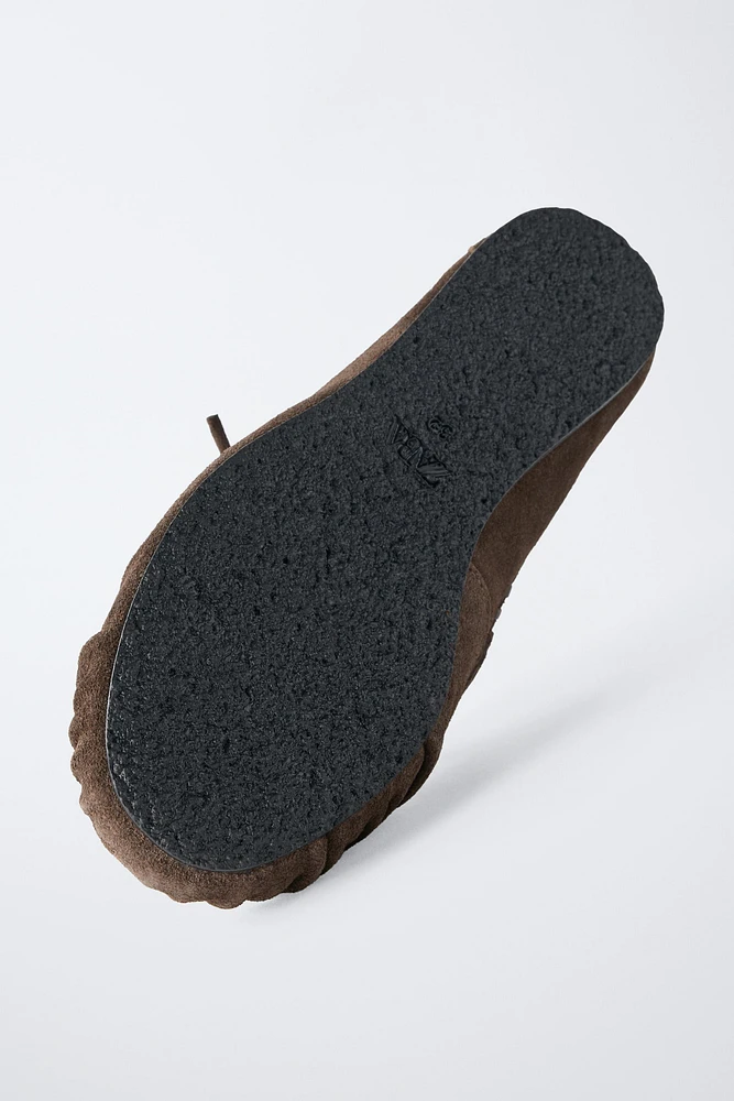 MOCASSINS À FRANGES EN CROÛTE DE CUIR