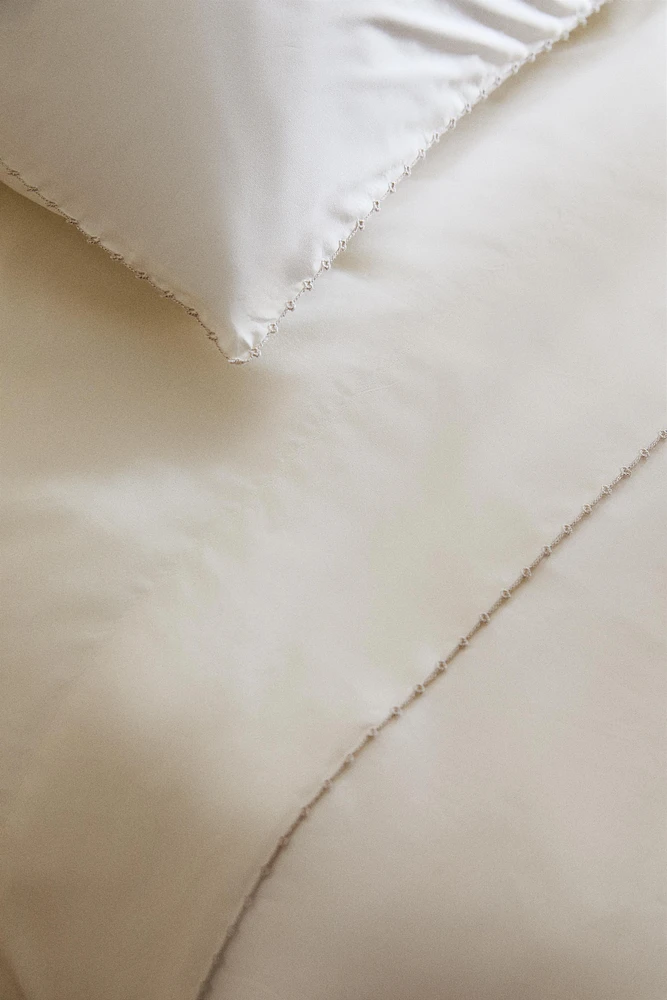 DRAP DE DESSUS BRODERIE PIQUÉE