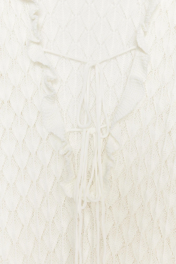 ROBE LONGUE EN MAILLE POINTELLE À VOLANTS