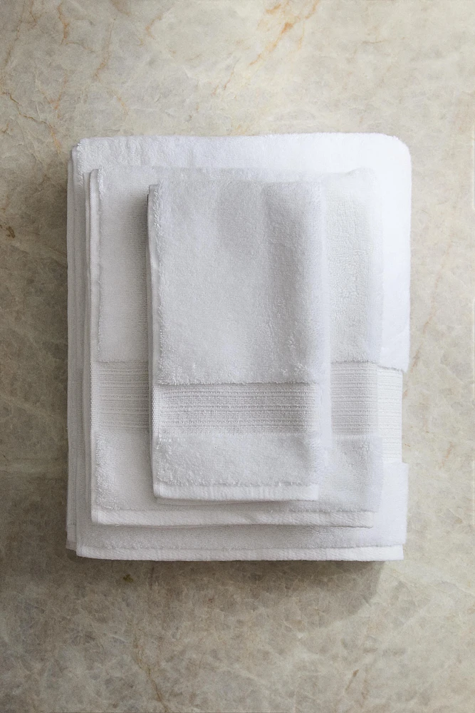 METALLIC THREAD BATH TOWEL WITH BORDER