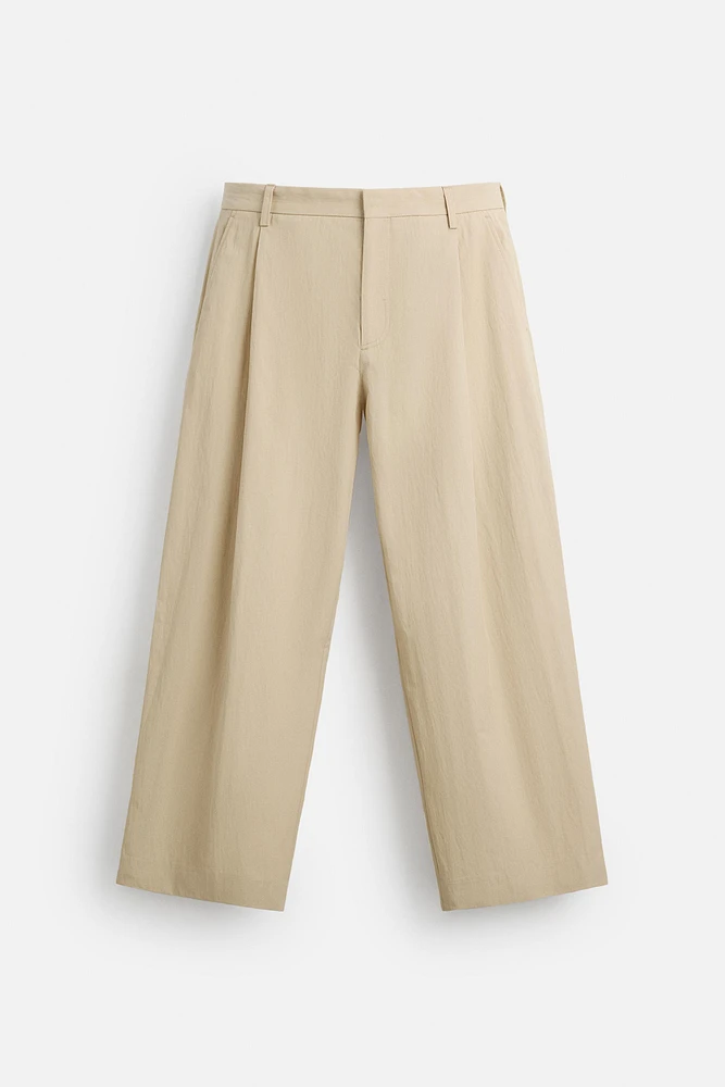 LIMITED EDITION RELAXED FIT PLEATED PANTS