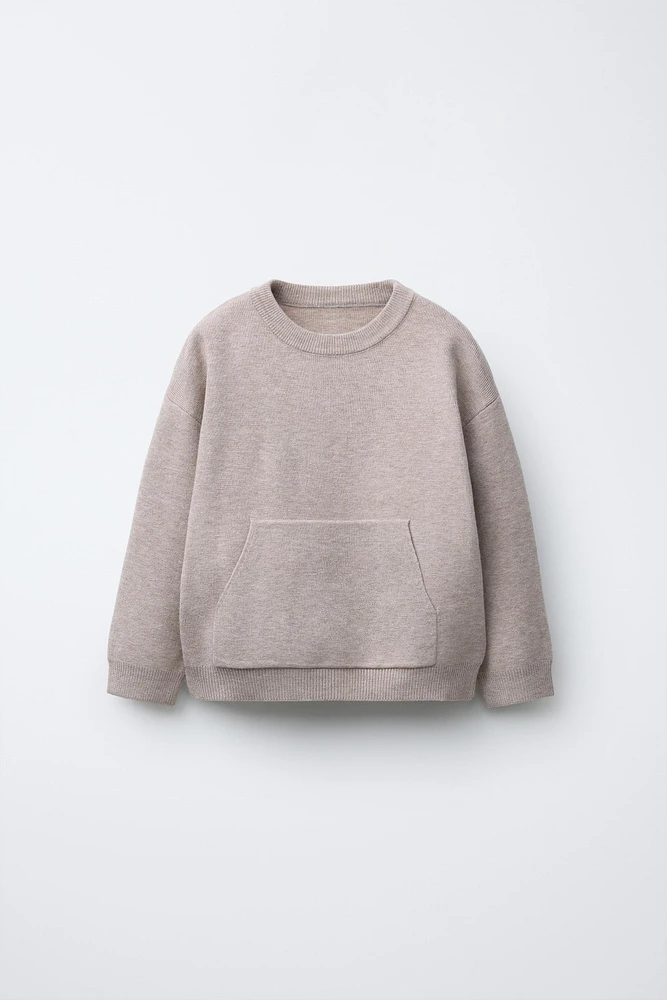 PULL EN MAILLE À POCHE