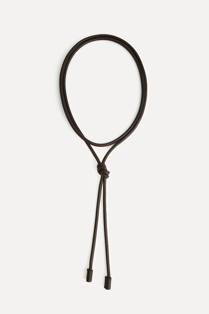CEINTURE CIRCULAIRE EN CUIR 50E ANNIVERSAIRE