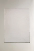 LIGHT-COLORED WOOL AREA RUG