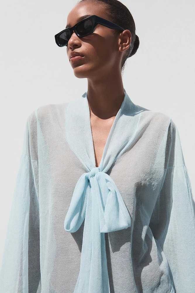 BLOUSE SEMI-TRANSPARENTE EN MAILLE