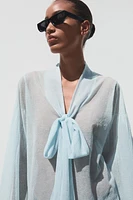 BLOUSE SEMI-TRANSPARENTE EN MAILLE