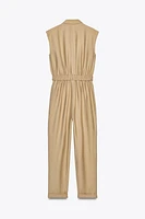 SLEEVELESS BELTED JUMPSUIT